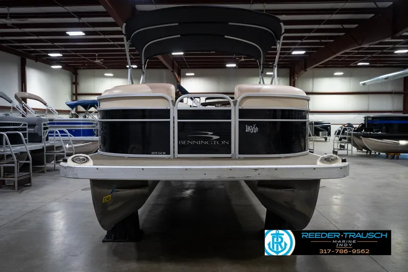 Slide: The Image of 2014 Bennington 2275GCW pontoon boat in indoor showroom with canopy. - 4