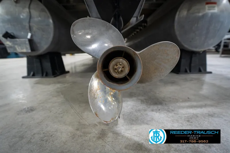 Slide: The Image of Yamaha 150 four-stroke engine on a 2014 Bennington 2275GCW pontoon boat in showroom. - 45