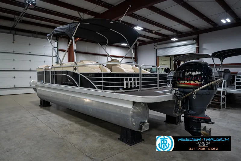 Slide: The Image of 2014 Bennington 2275GCW pontoon boat with Yamaha 150 engine in indoor storage. - 9