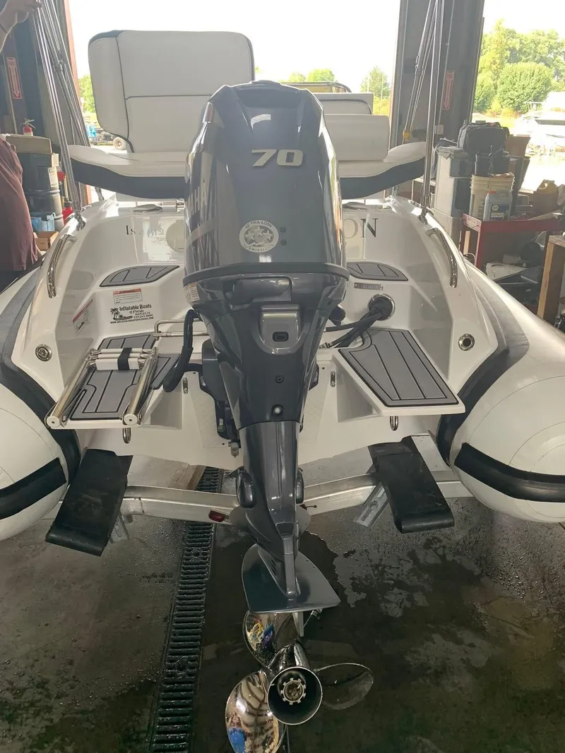 Slide: The Image of Walker Bay Venture 14 boat, 2021 model, with Yamaha 70 outboard motor in a garage setting. - 5