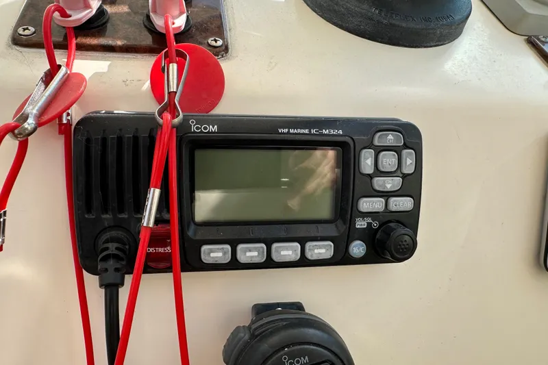 Slide: The Image of VHF marine radio Icom IC-M324 on 2002 Pursuit 2860 Denali boat dashboard. - 26