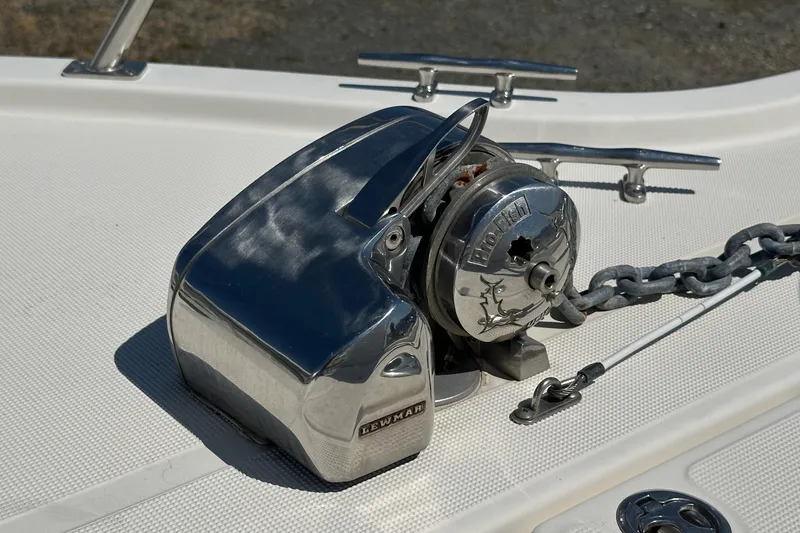 Slide: The Image of Chrome boat winch on 2002 Pursuit 2860 Denali, with anchor chain and cleats. - 48