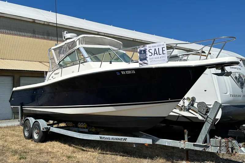 Slide: The Image of 2002 Pursuit 2860 Denali boat for sale on trailer, parked outdoors. - 7