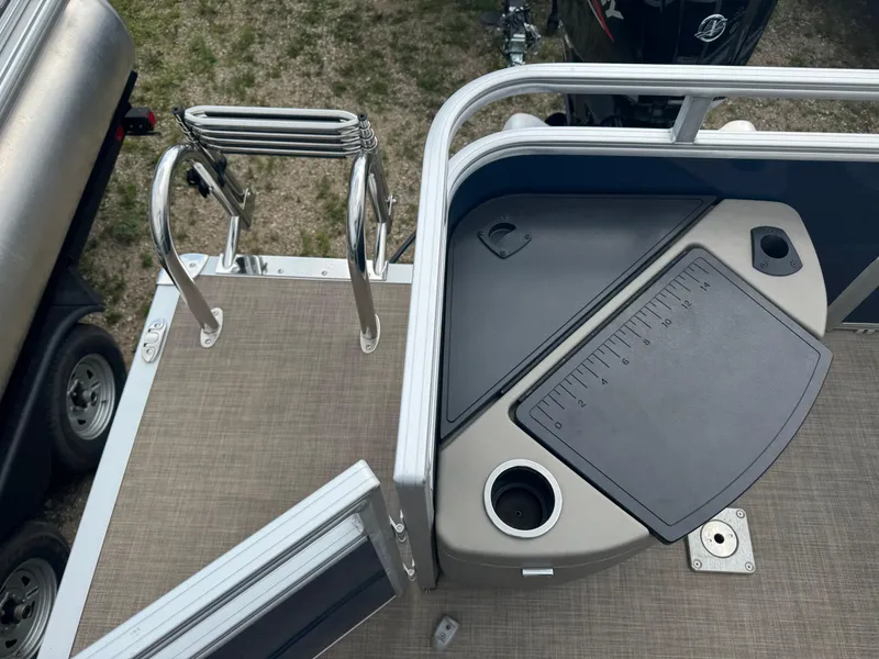 Slide: The Image of 2024 Sun Tracker Fishin' Barge 20 DLX deck with ladder and fishing station. - 15