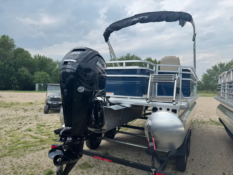 Slide: The Image of 2024 Sun Tracker Fishin' Barge 20 DLX pontoon boat with Mercury outboard motor. - 3