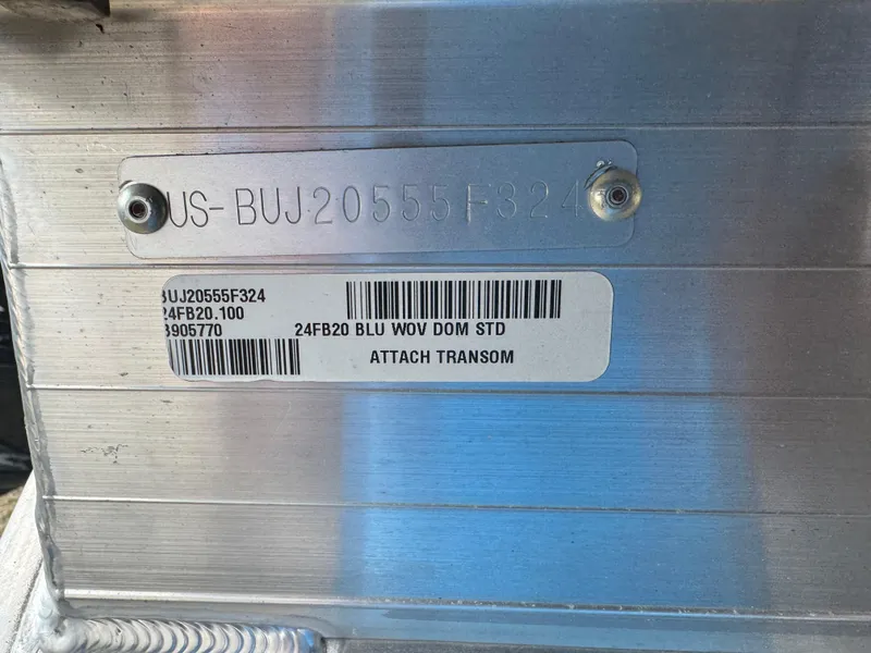 Slide: The Image of 2024 Sun Tracker Fishin' Barge 20 DLX transom with serial and barcode details. - 5