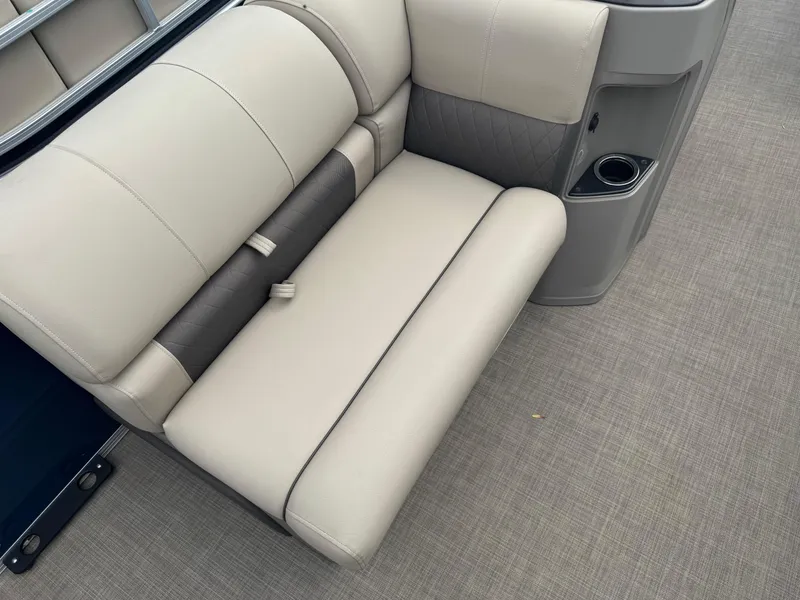 Slide: The Image of 2024 Sun Tracker Fishin' Barge 20 DLX interior seating with cup holder and stylish upholstery. - 8