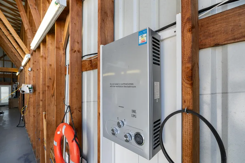 Slide: The Image of Interior of a 2006 Steelhead Boathouse with LPG heater and wooden beams. - 7