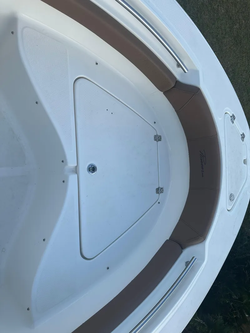 Slide: The Image of 2024 Pioneer 202 Sportfish boat interior with seating and storage compartment. - 16