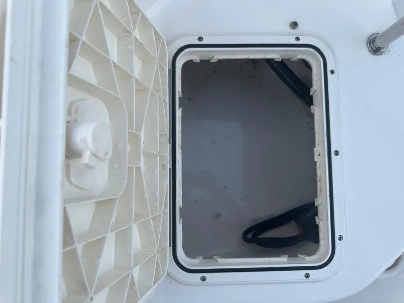 Slide: The Image of Open storage compartment on 2024 Pioneer 202 Sportfish boat. - 27