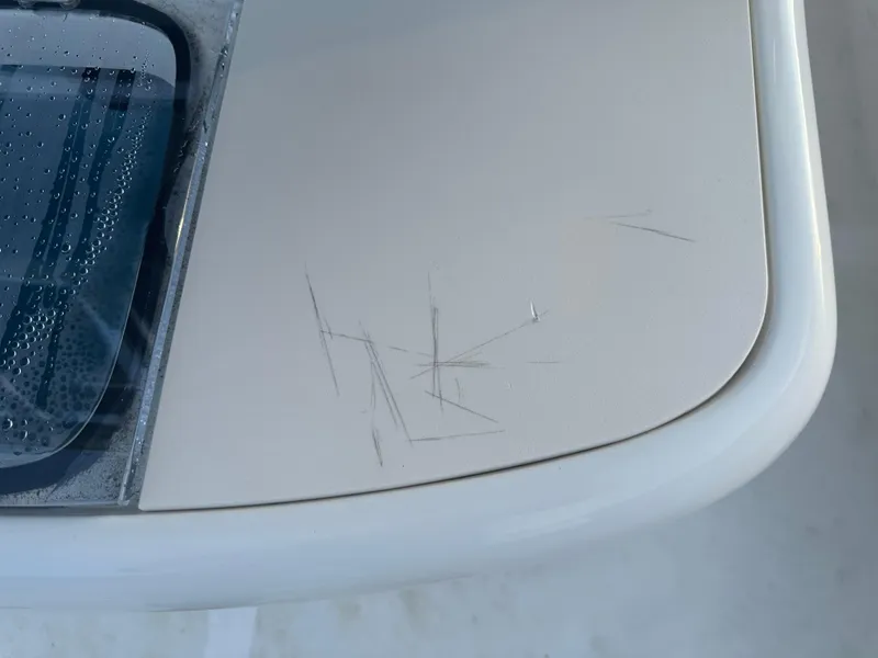 Slide: The Image of 2024 Pioneer 202 Sportfish boat with visible surface scratches. - 29