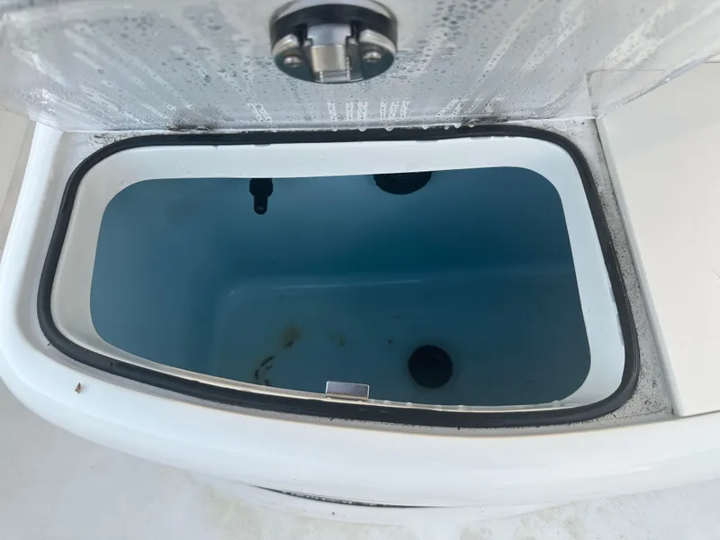 Slide: The Image of Open storage compartment on 2024 Pioneer 202 Sportfish boat. - 30