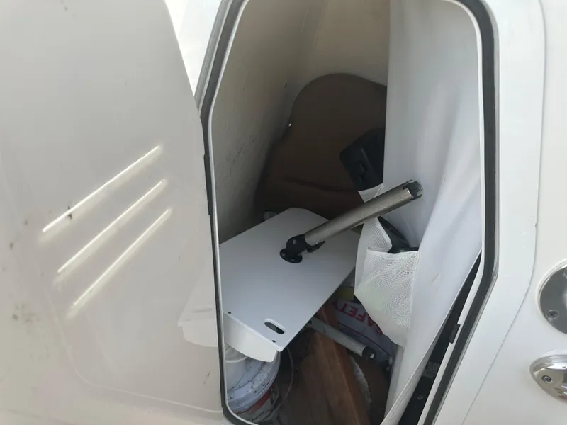 Slide: The Image of Storage compartment of 2024 Pioneer 202 Sportfish boat, showing interior items and equipment. - 36