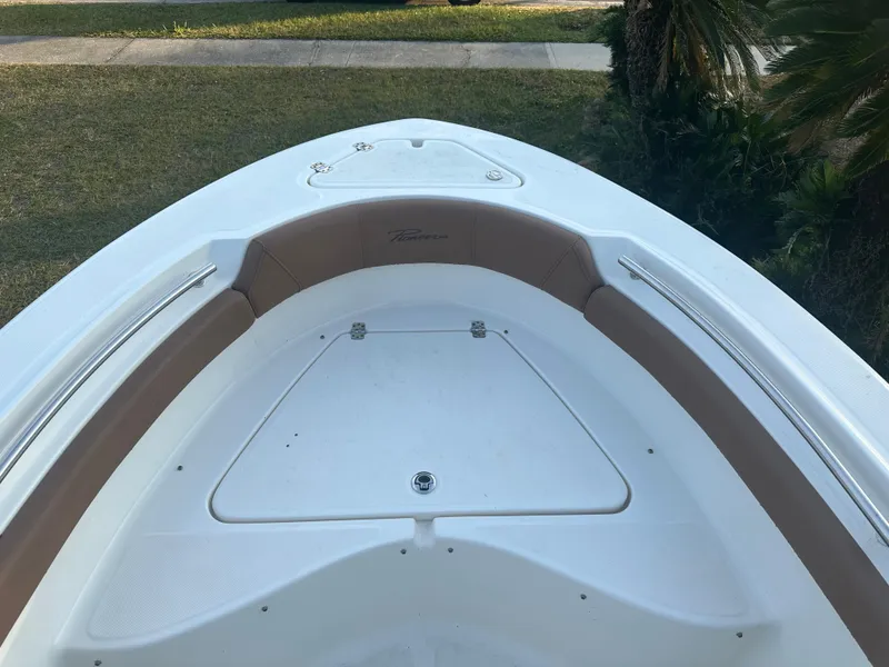 Slide: The Image of 2024 Pioneer 202 Sportfish boat bow with seating and storage. - 43