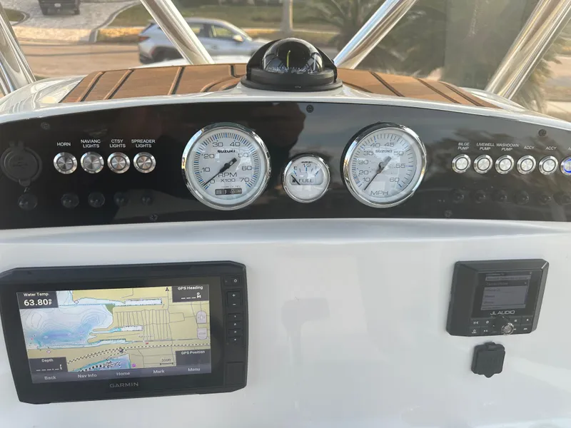 Slide: The Image of Dashboard of 2024 Pioneer 202 Sportfish boat with navigation and control instruments. - 49