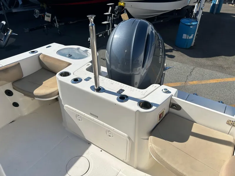 Slide: The Image of 2020 Sailfish 220 WAC boat interior with seating and Yamaha outboard motor. - 14