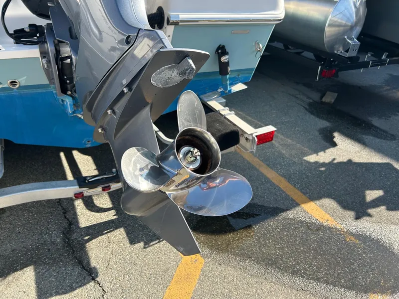 Slide: The Image of Propeller of a 2020 Sailfish 220 WAC boat on a trailer in a parking lot. - 23