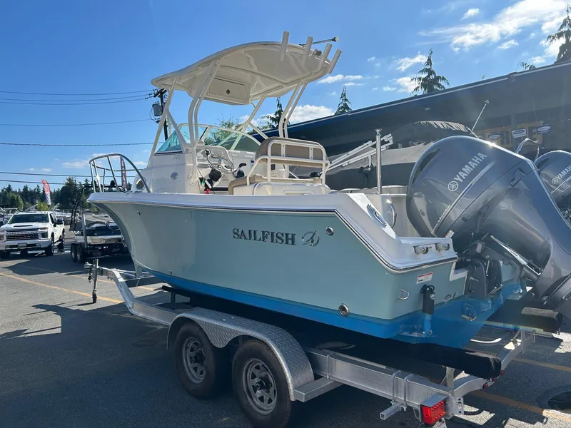 Slide: The Image of 2020 Sailfish 220 WAC boat on trailer with Yamaha engines, parked outdoors. - 3
