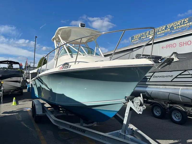 Slide: The Image of 2020 Sailfish 220 WAC boat on trailer at Seattle Water Sports dealership. - 4