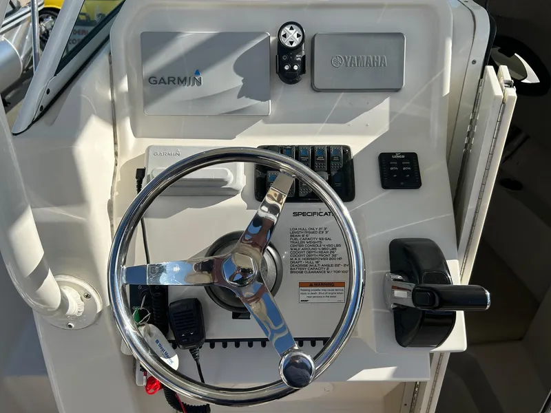 Slide: The Image of 2020 Sailfish 220 WAC boat dashboard with Garmin and Yamaha controls. - 9