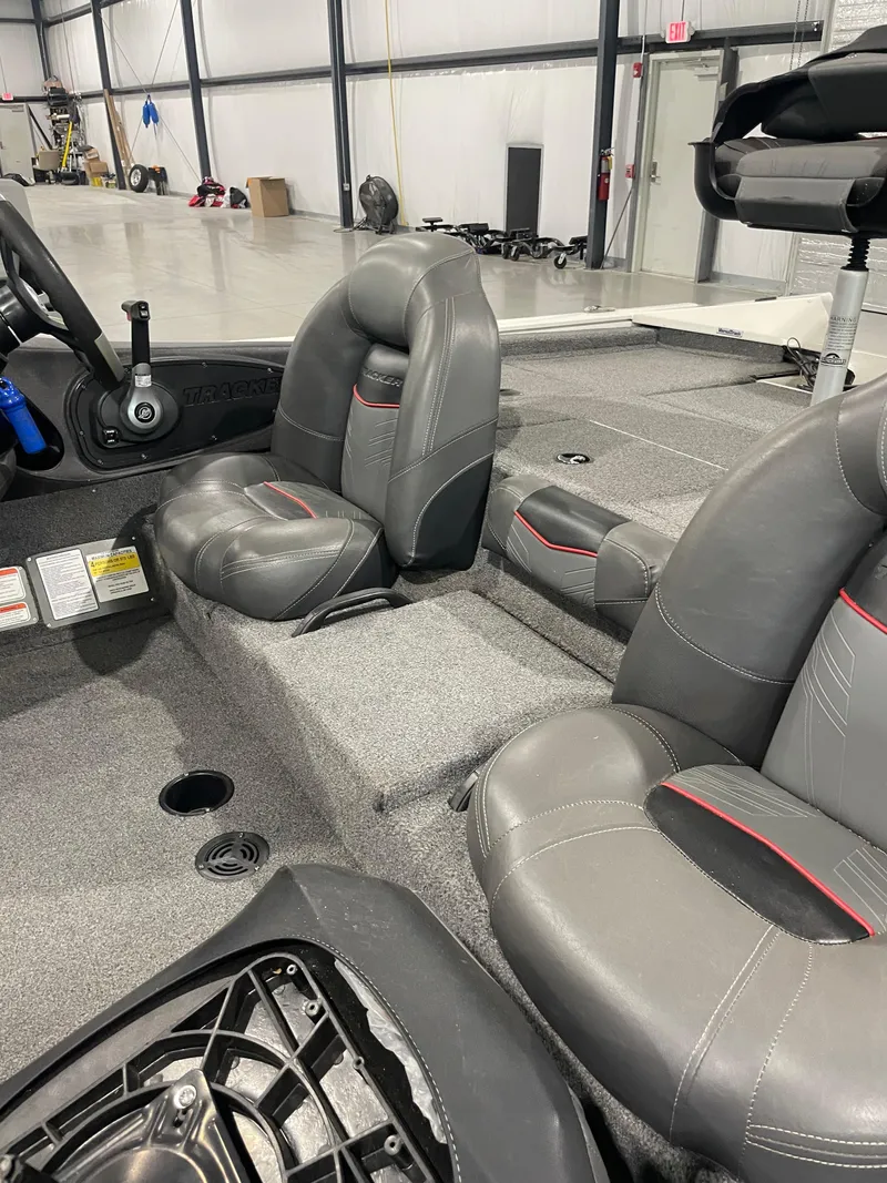 Slide: The Image of 2021 Bass Tracker 195 Pro Team XTE interior with gray seating and steering wheel. - 10