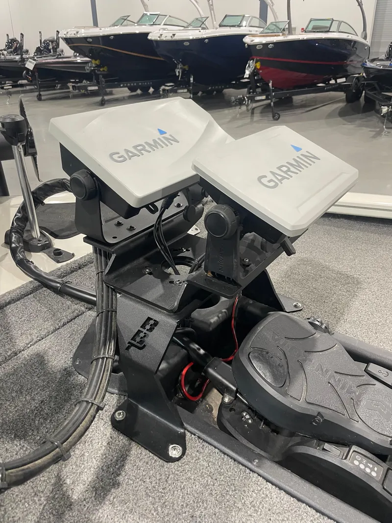 Slide: The Image of Bass Tracker 195 Pro Team XTE 2021 with dual Garmin displays on the dashboard. - 13