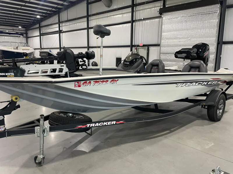 Slide: The Image of 2021 Bass Tracker 195 Pro Team XTE boat in a showroom, side view. - 15