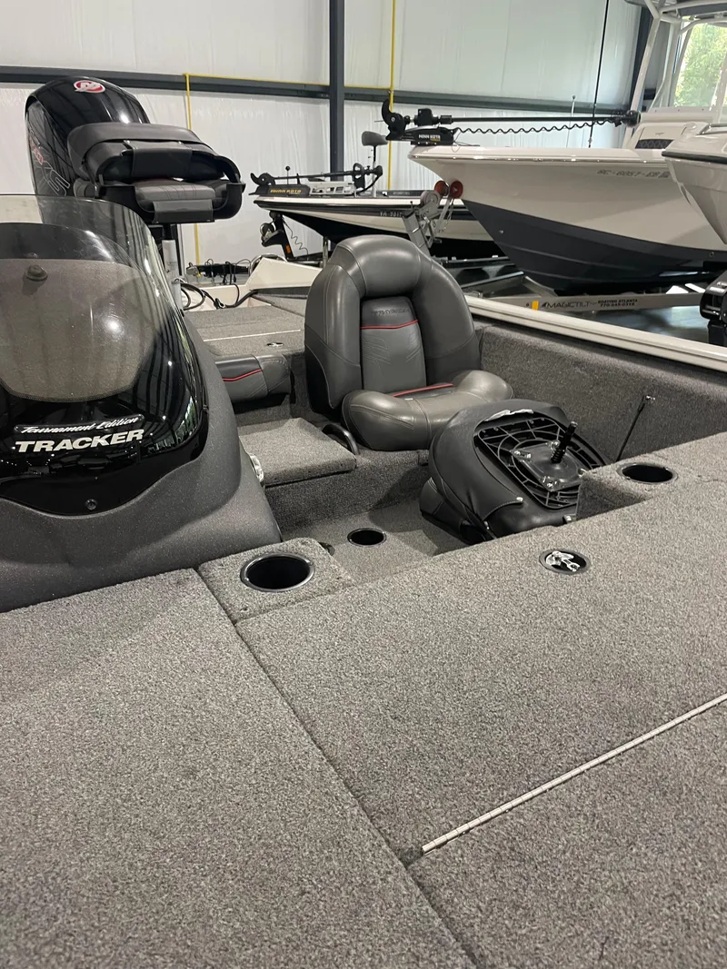 Slide: The Image of 2021 Bass Tracker 195 Pro Team XTE boat interior with seating and equipment. - 4