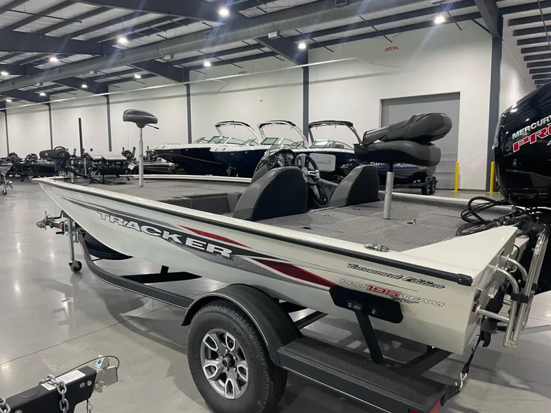 Slide: The Image of 2021 Bass Tracker 195 Pro Team XTE boat in showroom, side view. - 6