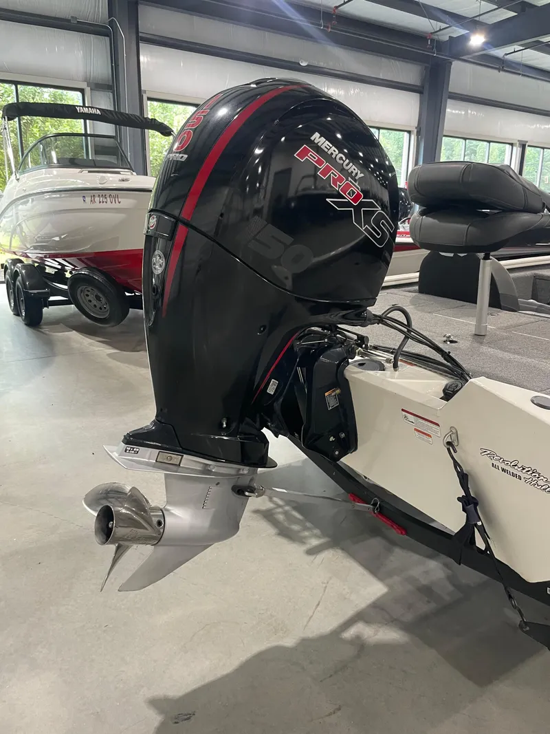 Slide: The Image of 2021 Bass Tracker 195 Pro Team XTE with Mercury Pro XS outboard motor in showroom. - 7