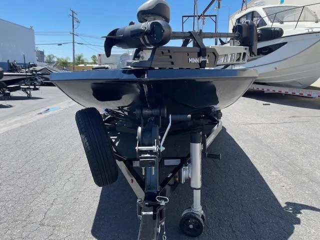 Slide: The Image of 2014 Lowe Stinger 18 HP boat on trailer, parked outdoors. - 6