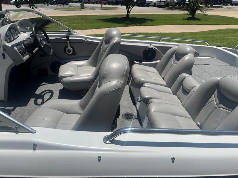 Slide: The Image of 2013 Skeeter SL190 boat interior with gray leather seats and steering wheel. - 10