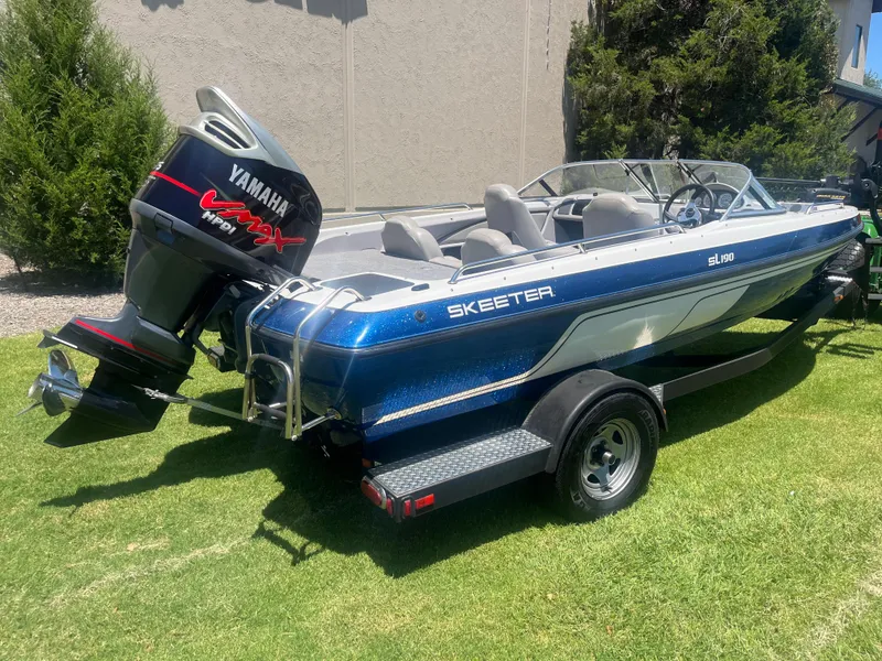 Slide: The Image of 2013 Skeeter SL190 boat with Yamaha VMAX engine on grass. - 5