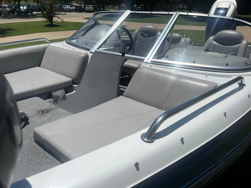 Slide: The Image of 2013 Skeeter SL190 boat interior with gray seating and windshield. - 9