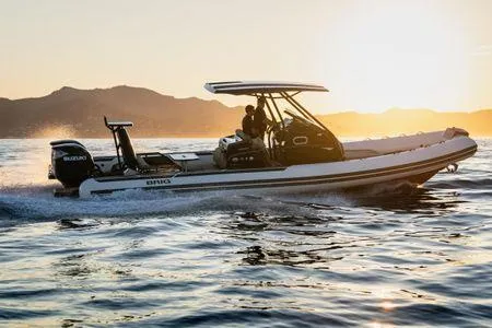 The Image of 2026 Brig Eagle 10 boat cruising at sunset on open water. - 0