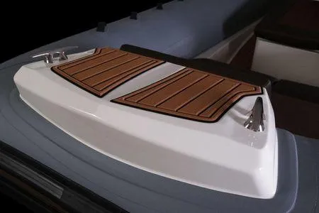 Slide: The Image of 2026 Brig Eagle 10 boat deck with sleek design and wood accents. - 13
