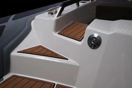 Slide: The Image of 2026 Brig Eagle 10 boat with sleek white design and wooden accents. - 14