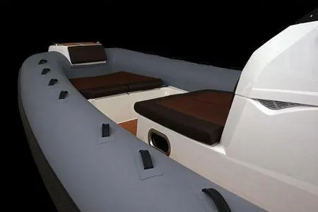 Slide: The Image of 2026 Brig Eagle 10 boat interior with cushioned seating and sleek design. - 6
