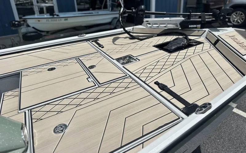 Slide: The Image of 2025 Avid 18 Vertex boat deck with sleek design and storage compartments. - 17