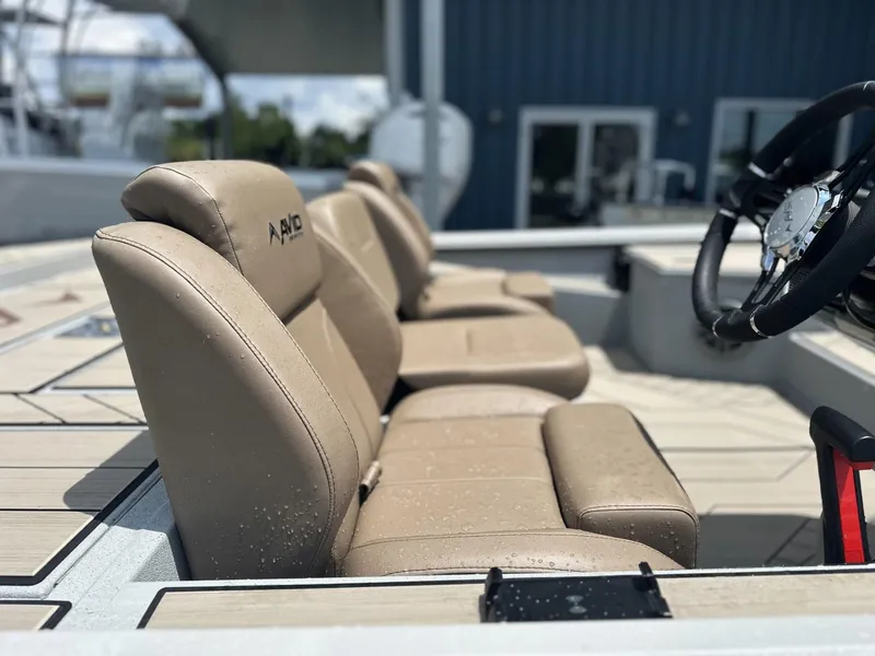 Slide: The Image of Luxurious seating in 2025 Avid 18 Vertex boat, featuring beige leather and sleek design. - 19