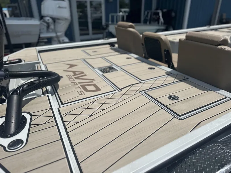 Slide: The Image of 2025 Avid 18 Vertex boat deck with sleek design and storage compartments. - 23