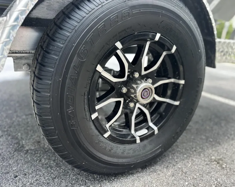 Slide: The Image of Close-up of a 2025 Avid 18 Vertex wheel with black alloy rim design. - 25