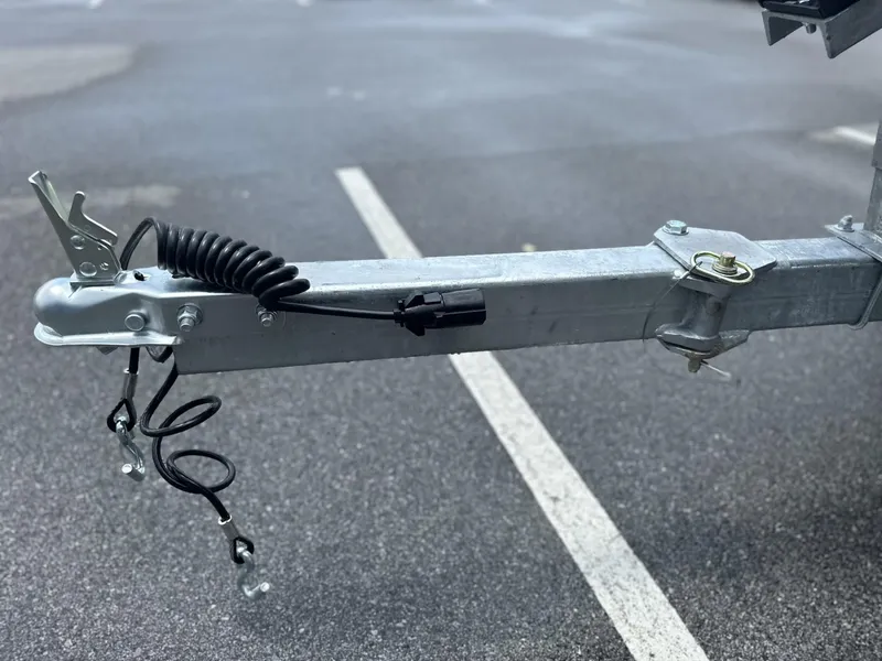 Slide: The Image of Trailer hitch of 2025 Avid 18 Vertex on asphalt parking lot. - 26