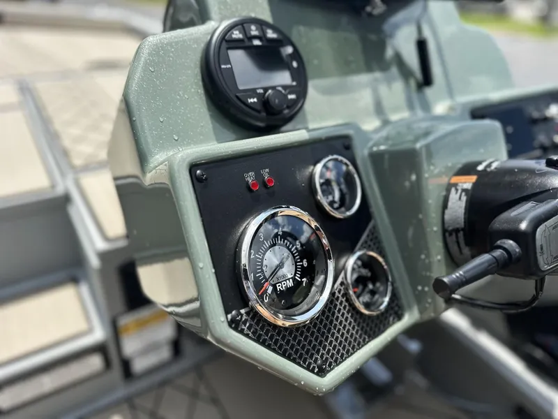 Slide: The Image of Control panel of 2025 Avid 18 Vertex boat with RPM gauge and controls. - 4