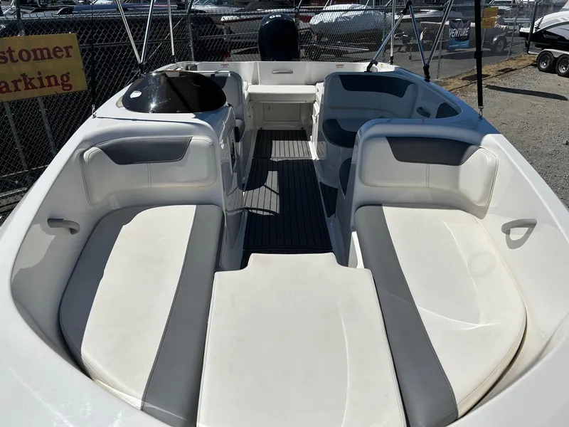 Slide: The Image of 2020 Bayliner Element E18 boat interior with spacious seating and modern design. - 12