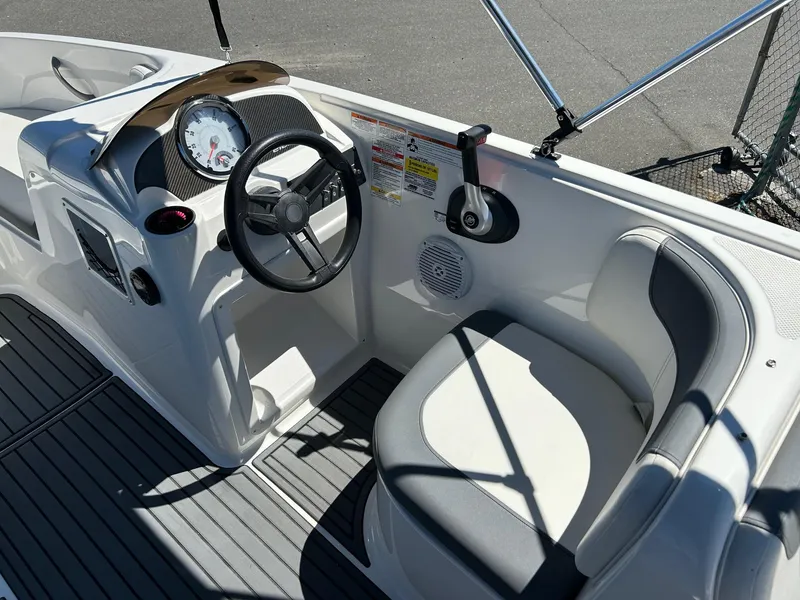 Slide: The Image of 2020 Bayliner Element E18 boat cockpit with steering wheel and seating. - 6