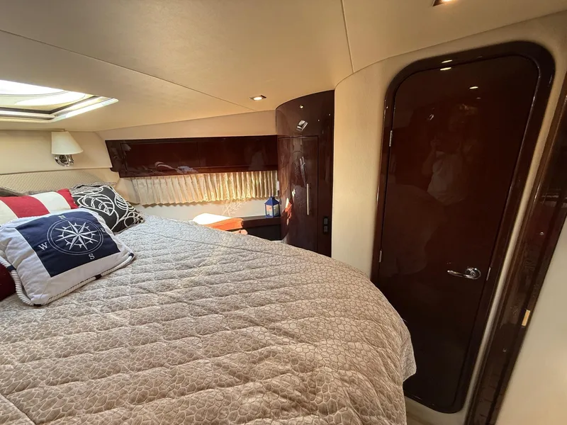 Slide: The Image of Luxurious cabin interior of 2015 Regal 46 Sport Coupe yacht with cozy bedding. - 20