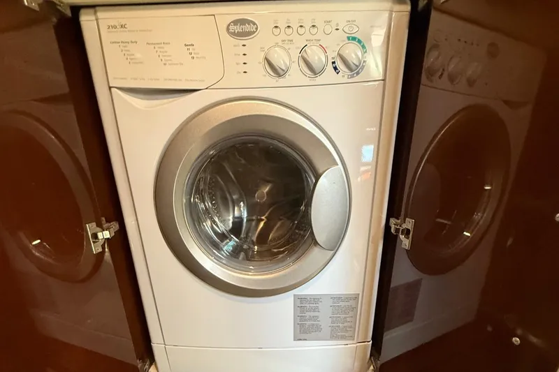 Slide: The Image of Splendide washing machine inside 2015 Regal 46 Sport Coupe yacht. - 21