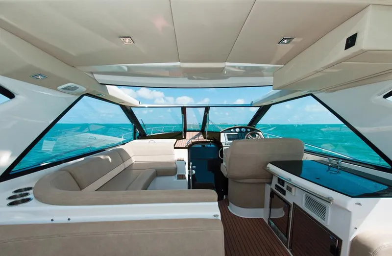 Slide: The Image of Manufacturer Provided Image: Interior of a 2015 Regal 46 Sport Coupe yacht with ocean view. - 28