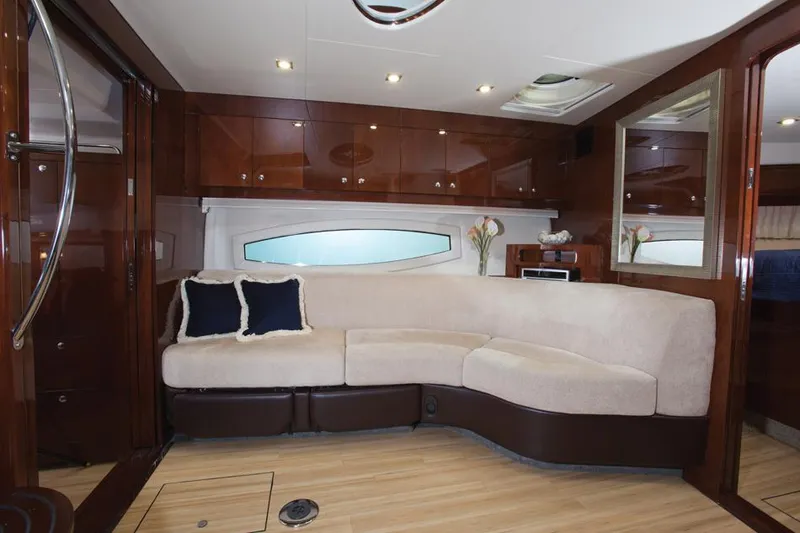 Slide: The Image of Manufacturer Provided Image: Luxurious interior of 2015 Regal 46 Sport Coupe with plush seating and wooden finishes. - 34